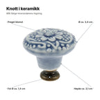 Knott i keramikk forklart: preget blomst, Ø ca. 3,4 cm, høyde ca. 3,1 cm, fot Ø ca. 1,4 cm