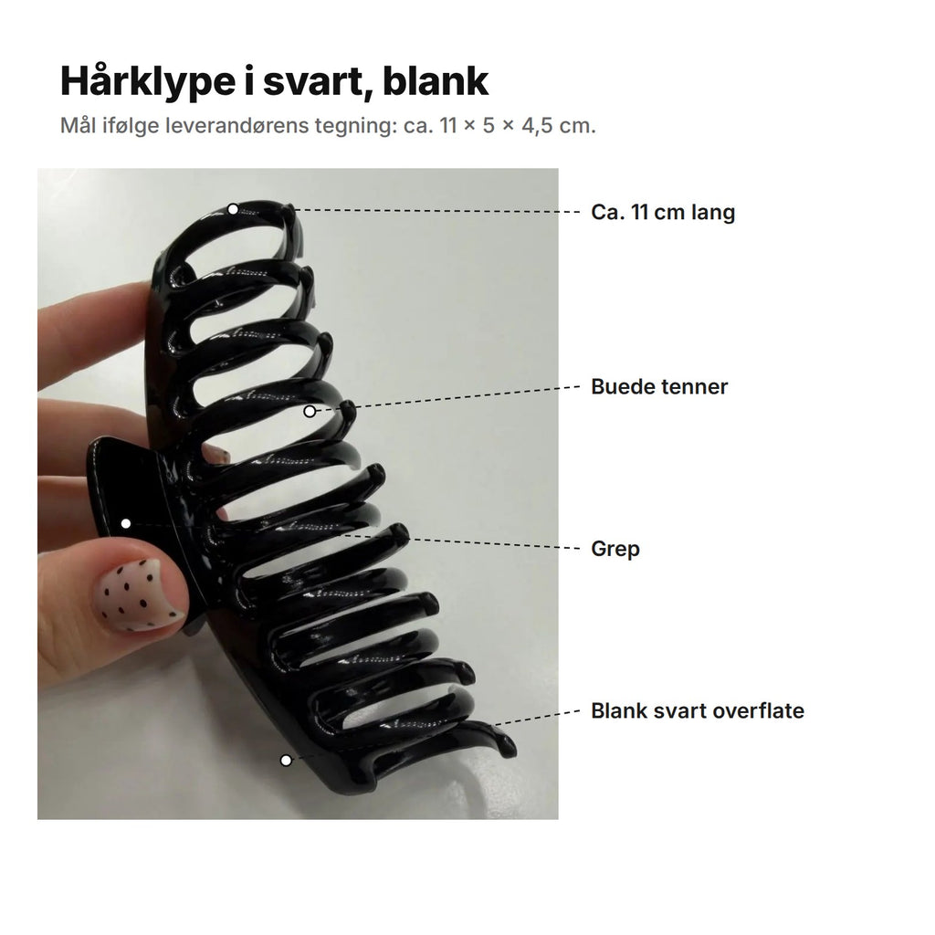 Hårklype i blank svart forklart: ca. 11 cm lang, buede tenner, grep og blank svart overflate