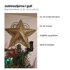 Juletrestjerne i gull forklart: ca. 25 cm høy med spiral, ca. 20 cm bred, gullglitter og perlekant, spiral til tretoppen