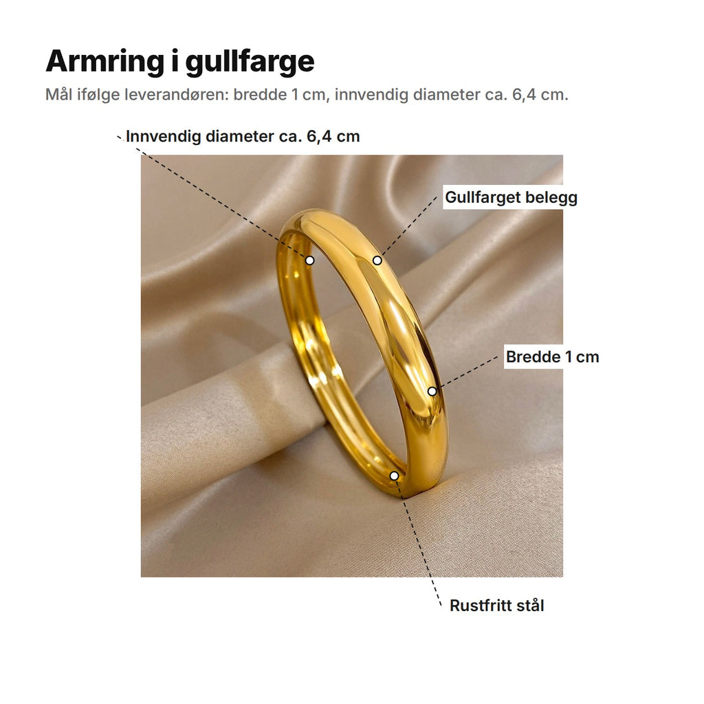 Armring i gullfarge forklart: innvendig diameter ca. 6,4 cm, gullfarget belegg, bredde 1 cm, rustfritt stål