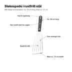 Stekespaden forklart: hull til oppheng, sort skaft med tre nagler, ca. 28 cm lang, fem avlange hull, rustfritt stål og et blad på ca. 7,5 cm