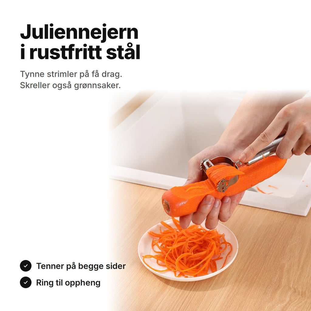 Juliennejern i rustfritt stål som gjør en gulrot til tynne strimler ned i en skål