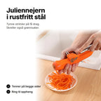 Juliennejern i rustfritt stål som gjør en gulrot til tynne strimler ned i en skål