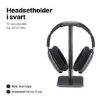 Svart headsetholder, ca. 24 cm høy, med myk, buet topp og kvadratisk fot på ca. 11 cm