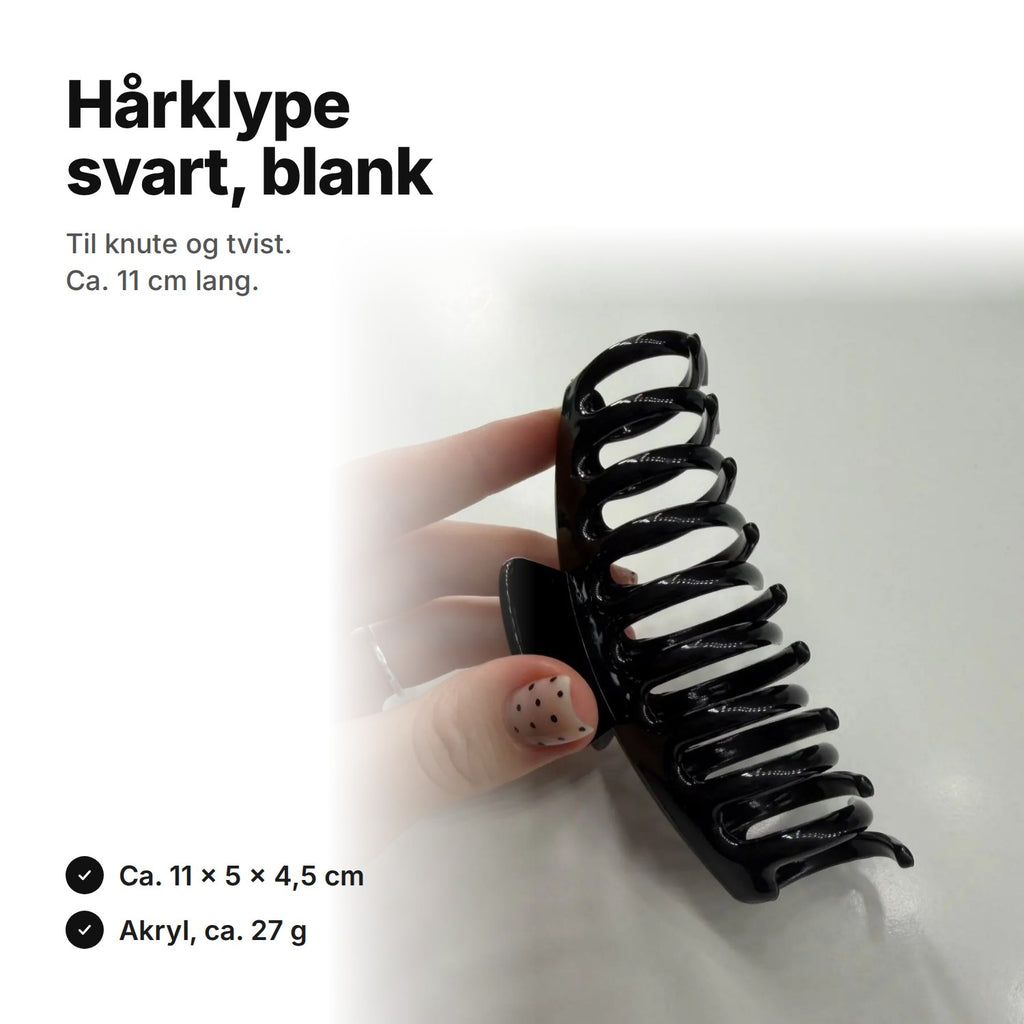 Blank svart hårklype, ca. 11 cm lang, 5 cm høy og 4,5 cm tykk
