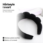 Svart polstret hårbøyle med boblete overflate, ca. 17,5 cm bred og bånd ca. 3,7 cm