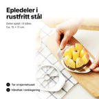 Epledeler i rustfritt stål presses ned over et eple – deler i 8 båter, ca. 15 × 11 cm